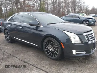 2014 Cadillac XTS Luxury z VIN 2G61N5S35E9247170, wystawiony jako IAAI lot #41728220 z przebiegiem 111 139 mil mil oraz . Historia ofert i sprzedaży dostępna na DreamBid. Obrazek 1.