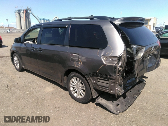 2014 Toyota Sienna XLE with VIN 5TDYK3DC2ES418860, listed as a IAAI auction lot 40139260 with 67,599 mi miles and . Bid and sale history available at DreamBid. Image 3.