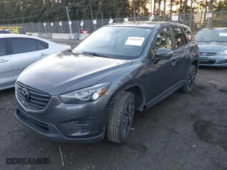 2016 Mazda CX-5 Grand Touring with VIN JM3KE4DY3G0817899, listed as a IAAI auction lot 41287459 with NaN miles. Bid and sale history available at carsss.com. Image 19.