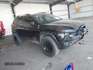 2014 Jeep Cherokee Trailhawk with VIN 1C4PJMBS4EW241159, listed as a IAAI auction lot 42268562 with 121,448 mi miles and . Bid and sale history available at DreamBid. Image 1.