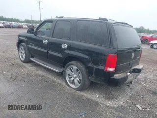 2003 Cadillac Escalade z VIN 1GYEK63N13R140496, wystawiony jako IAAI lot #42366303 z przebiegiem 90 940 mil mil oraz . Historia ofert i sprzedaży dostępna na DreamBid. Obrazek 3.