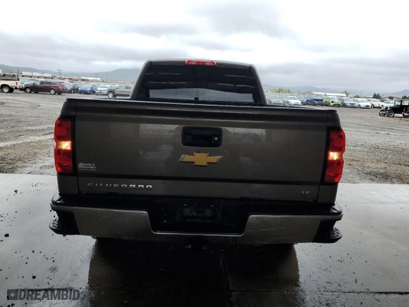 2015 Chevrolet Silverado 1500 LT with VIN 1GCUKREC5FF199913, listed as a Copart auction lot 58476584 with 129,616 mi miles and Salvage Title. Bid and sale history available at carsss.com. Image 6.