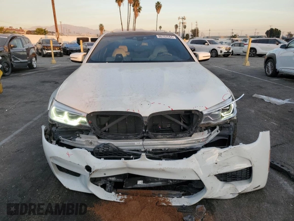 2019 BMW M5 z VIN WBSJF0C53KB284878, wystawiony jako Copart lot #86763564 z przebiegiem Nie podano mil oraz Szkoda całkowita • Salvage title. Historia ofert i sprzedaży dostępna na DreamBid. Obrazek 5.