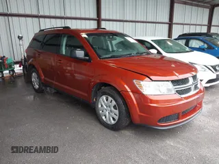 2014 Dodge Journey SE with VIN 3C4PDCAB1ET227003, listed as a IAAI auction lot 42143105 with 212,334 mi miles. Bid and sale history available at carsss.com. Image 1.