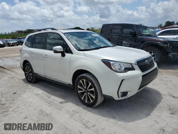 2017 Subaru Forester Touring with VIN JF2SJGWC2HH594766, listed as a Copart auction lot 50199083 with 51,189 mi miles and . Bid and sale history available at DreamBid. Image 4.