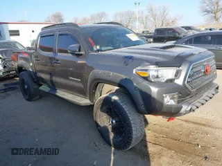 2017 Toyota Tacoma SR5 with VIN 3TMCZ5AN5HM057779, listed as a IAAI auction lot 41008992 with 98,804 mi miles. Bid and sale history available at carsss.com. Image 1.