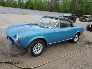 1974 FIAT 124 Spider z VIN 124CS10081683, wystawiony jako Copart lot #58650195 z przebiegiem 143 647 mil mil oraz Czysty tytuł • Clean title. Historia ofert i sprzedaży dostępna na DreamBid. Obrazek 1.