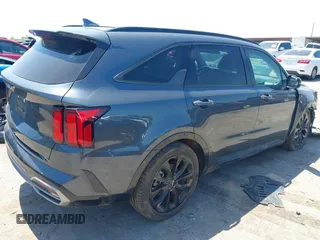 2023 Kia Sorento SX z VIN 5XYRK4LF3PG242259, wystawiony jako IAAI lot #41970398 z przebiegiem 31 293 mil mil oraz . Historia ofert i sprzedaży dostępna na DreamBid. Obrazek 4.