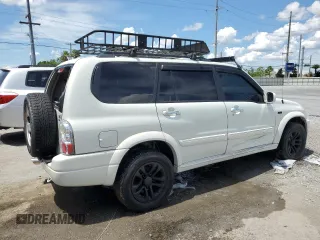 2004 Suzuki XL7 LX with VIN JS3TX92V444107106, listed as a Copart auction lot 62322035 with 94,380 mi miles and Salvage title. Bid and sale history available at DreamBid. Image 3.