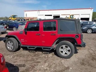 2007 Jeep Wrangler Unlimited X with VIN 1J4GB39197L150245, listed as a IAAI auction lot 41920390 with 239,532 mi miles and . Bid and sale history available at DreamBid. Image 14.