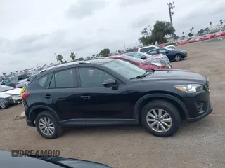 2016 Mazda CX-5 Sport with VIN JM3KE2BY4G0761933, listed as a IAAI auction lot 41709274 with 131,127 mi miles. Bid and sale history available at carsss.com. Image 14.