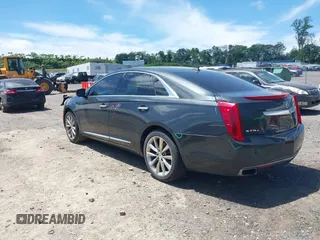 2013 Cadillac XTS Luxury z VIN 2G61R5S33D9101434, wystawiony jako IAAI lot #42290199 z przebiegiem 48 075 mil mil oraz . Historia ofert i sprzedaży dostępna na DreamBid. Obrazek 3.