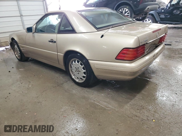 1997 Mercedes-Benz SL 500 with VIN WDBFA67F5VF147986, listed as a Copart auction lot 84255574 with 158,607 mi miles and Salvage title. Bid and sale history available at DreamBid. Image 2.