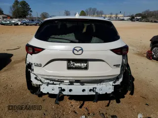 2021 Mazda CX-5 Signature with VIN JM3KFBEY5M0352778, listed as a Copart auction lot 47016035 with 37,961 mi miles and Salvage Title. Bid and sale history available at carsss.com. Image 6.