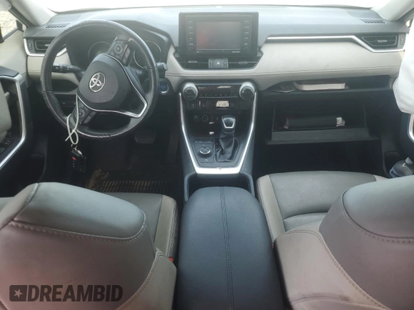 2022 Toyota RAV4 Hybrid XLE Premium with VIN JTMB6RFV4ND535282, listed as a Copart auction lot 61249445 with 82,398 mi miles and Salvage title. Bid and sale history available at DreamBid. Image 8.