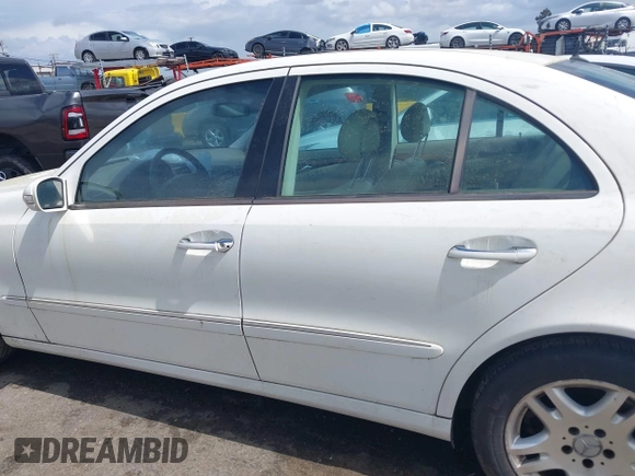 2003 Mercedes-Benz E-Class 3.2L with VIN WDBUF65J23A120318, listed as a IAAI auction lot 41927993 with 113,578 mi miles. Bid and sale history available at carsss.com. Image 14.