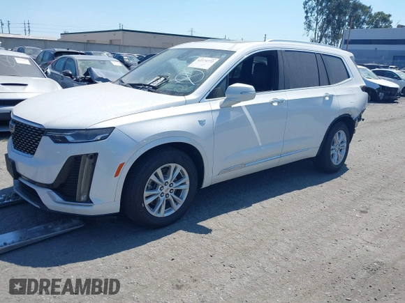 2021 Cadillac XT6 Luxury with VIN 1GYKPAR47MZ221123, listed as a IAAI auction lot 42374772 with 69,829 mi miles and . Bid and sale history available at DreamBid. Image 2.