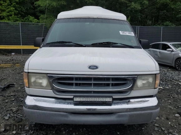 2000 Ford Econoline Cargo Recreational z VIN 1FDRE14L3YHA17676, wystawiony jako Copart lot #58571465 z przebiegiem 174 129 mil mil oraz Szkoda całkowita • Salvage title. Historia ofert i sprzedaży dostępna na DreamBid. Obrazek 5.
