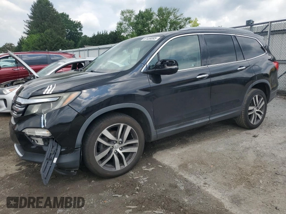 2017 Honda Pilot Touring with VIN 5FNYF6H90HB024321, listed as a Copart auction lot 57459895 with 134,244 mi miles and Salvage title. Bid and sale history available at DreamBid. Image 1.