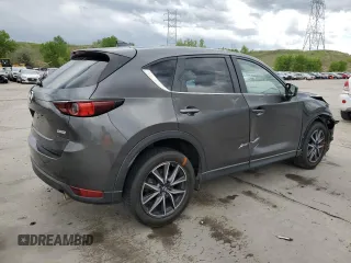 2018 Mazda CX-5 Touring z VIN JM3KFBCM4J0349687, wystawiony jako Copart lot #55857945 z przebiegiem Nie podano mil oraz Szkoda całkowita • Salvage title. Historia ofert i sprzedaży dostępna na DreamBid. Obrazek 3.