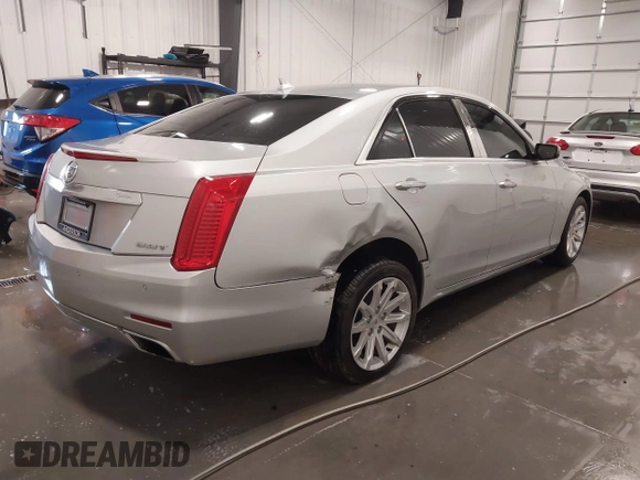 2014 Cadillac CTS Luxury AWD with VIN 1G6AX5SX3E0181029, listed as a IAAI auction lot 41895745 with 68,799 mi miles and . Bid and sale history available at DreamBid. Image 4.