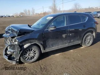 2021 Mazda CX-5 Touring z VIN JM3KFBCM7M1121908, wystawiony jako Copart lot #53059435 z przebiegiem 26 304 mil mil oraz Szkody całkowita. Historia ofert i sprzedaży dostępna na DreamBid. Obrazek 1.