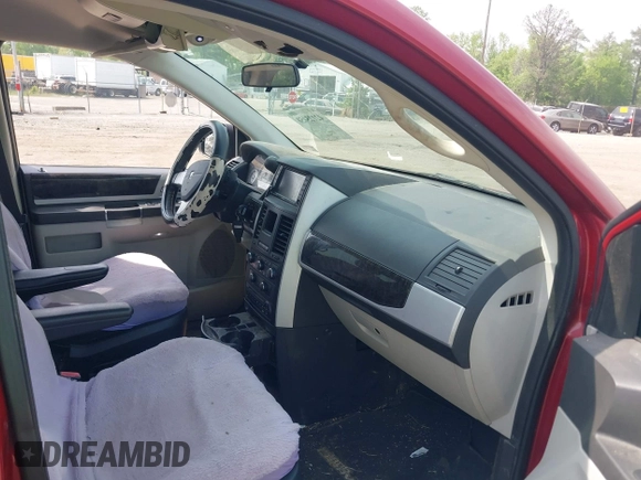 2010 Dodge Grand Caravan SXT with VIN 2D4RN5D17AR145958, listed as a IAAI auction lot 42125450 with 229,790 mi miles and . Bid and sale history available at DreamBid. Image 5.