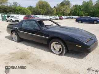 1987 Pontiac Firebird z VIN 1G2FS2184HL222415, wystawiony jako Copart lot #54878805 z przebiegiem 97 287 mil mil oraz Szkody całkowita. Historia ofert i sprzedaży dostępna na DreamBid. Obrazek 4.