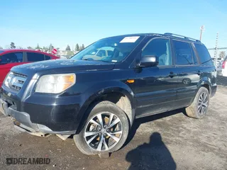 2006 Honda Pilot EX-L with VIN 5FNYF28586B037160, listed as a IAAI auction lot 41798991 with 207,486 mi miles. Bid and sale history available at carsss.com. Image 14.