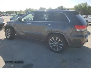 2017 Jeep Grand Cherokee Overland with VIN 1C4RJFCG9HC601806, listed as a Copart auction lot 61786275 with 122,898 mi miles and Salvage title. Bid and sale history available at DreamBid. Image 2.