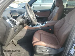 2025 BMW X5 xDrive40i with VIN 5UX23EU01S9Z44555, listed as a Copart auction lot 48656295 with 90 mi miles and Salvage Title. Bid and sale history available at carsss.com. Image 7.