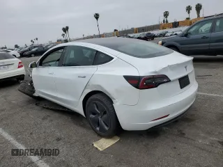2020 Tesla Model 3 Standard Range Plus with VIN 5YJ3E1EA5LF747010, listed as a Copart auction lot 50937975 with Not Provided miles and Salvage Title. Bid and sale history available at DreamBid. Image 2.