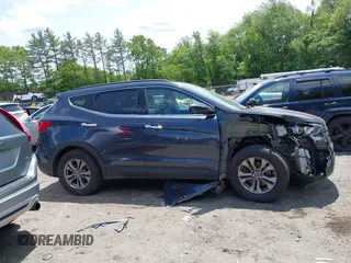 2014 Hyundai Santa Fe with VIN 5XYZUDLB6EG218980, listed as a IAAI auction lot 42391630 with 136,710 mi miles and . Bid and sale history available at DreamBid. Image 13.