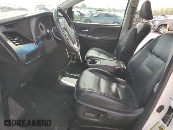 2015 Toyota Sienna SE с VIN 5TDXK3DC8FS582014, выставлен на аукционе Copart как лот 58018685 с пробегом 136 527 миль миль и Списание • Salvage title. История ставок и продаж доступна на DreamBid. Изображение 7.