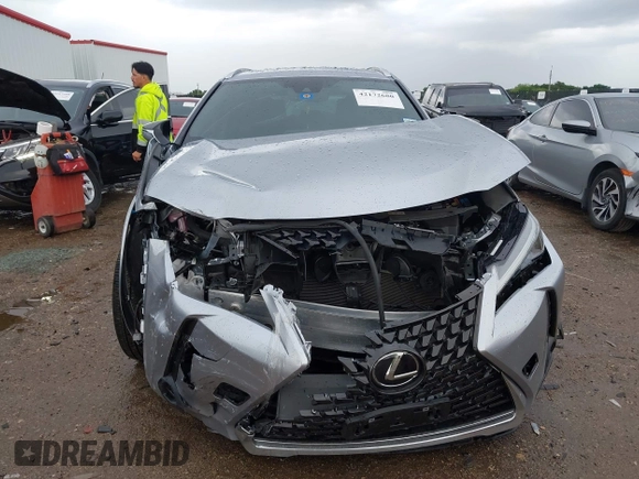 2024 Lexus UX 250h Premium z VIN JTHP6JBH7R2193351, wystawiony jako IAAI lot #42172680 z przebiegiem 10 072 mil mil oraz . Historia ofert i sprzedaży dostępna na DreamBid. Obrazek 12.