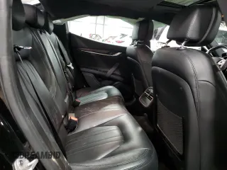 2017 Maserati Ghibli S Q4 z VIN ZAM57RTA0H1196498, wystawiony jako Copart lot #79911364 z przebiegiem 69 950 mil mil oraz Szkody całkowita. Historia ofert i sprzedaży dostępna na DreamBid. Obrazek 11.