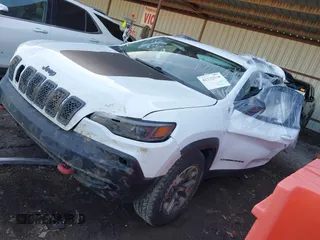 2021 Jeep Cherokee Trailhawk with VIN 1C4PJMBX4MD153086, listed as a IAAI auction lot 41132030 with 56,367 mi miles and . Bid and sale history available at DreamBid. Image 2.