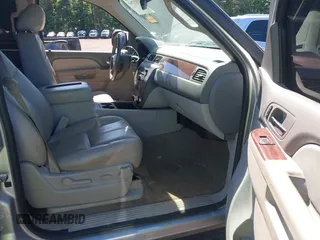 2014 Chevrolet Tahoe LT with VIN 1GNSCBE00ER147899, listed as a IAAI auction lot 42322761 with 299,342 mi miles and . Bid and sale history available at DreamBid. Image 5.
