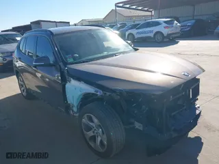2013 BMW X1 28i with VIN WBAVM1C5XDVW42366, listed as a IAAI auction lot 38457662 with 107,116 mi miles. Bid and sale history available at carsss.com. Image 1.