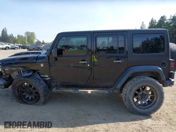 2015 Jeep Wrangler Unlimited Willys Wheeler with VIN 1C4BJWDG9FL750049, listed as a IAAI auction lot 42136188 with 115,328 mi miles and . Bid and sale history available at DreamBid. Image 15.