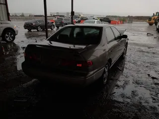 2001 Toyota Camry CE z VIN JT2BG22K410544168, wystawiony jako IAAI lot #42201412 z przebiegiem 158 500 mil mil oraz . Historia ofert i sprzedaży dostępna na DreamBid. Obrazek 4.