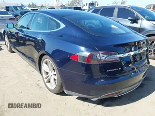 2013 Tesla Model S with VIN 5YJSA1CNXDFP28192, listed as a IAAI auction lot 42227521 with 60,967 mi miles and . Bid and sale history available at DreamBid. Image 3.
