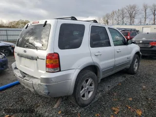 2005 Ford Escape Hybrid with VIN 1FMCU95H95KC74177, listed as a Copart auction lot 77361724 with 195,199 mi miles and Salvage Title. Bid and sale history available at carsss.com. Image 3.