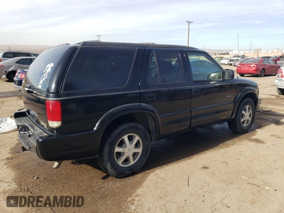 2000 Oldsmobile Bravada z VIN 1GHDT13W3Y2178106, wystawiony jako Copart lot #85069954 z przebiegiem 211 164 mil mil oraz Szkody całkowita. Historia ofert i sprzedaży dostępna na DreamBid. Obrazek 3.