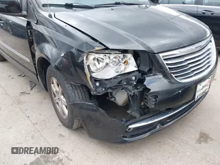 2013 Chrysler Town & Country Touring with VIN 2C4RC1BG5DR554662, listed as a IAAI auction lot 41833006 with 143,626 mi miles and . Bid and sale history available at DreamBid. Image 6.
