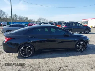 2023 Hyundai Elantra N Line z VIN KMHLR4AF9PU609633, wystawiony jako IAAI lot #41758887 z przebiegiem 24 000 mil mil oraz . Historia ofert i sprzedaży dostępna na DreamBid. Obrazek 14.