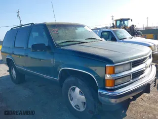 1997 Chevrolet Tahoe with VIN 1GNEK13RXVJ375189, listed as a IAAI auction lot 41959601 with 153,589 mi miles. Bid and sale history available at carsss.com. Image 1.