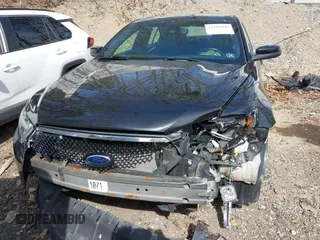 2014 Ford Taurus SHO with VIN 1FAHP2KT8EG131067, listed as a IAAI auction lot 42102086 with 107,822 mi miles. Bid and sale history available at carsss.com. Image 12.