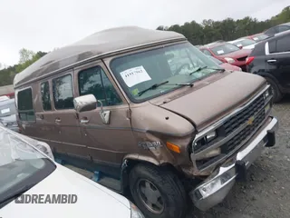 1995 Chevrolet Chevy Van z VIN 1GBEG25K8SF245639, wystawiony jako IAAI lot #41917862 z przebiegiem 89 015 mil mil oraz . Historia ofert i sprzedaży dostępna na DreamBid. Obrazek 13.