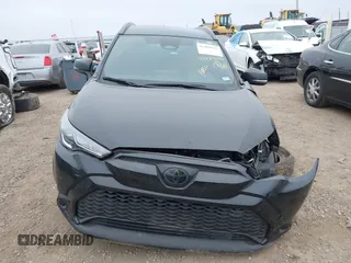 2023 Toyota Corolla Cross Hybrid S with VIN 7MUFBABG6PV010999, listed as a IAAI auction lot 41489541 with 14,707 mi miles and . Bid and sale history available at DreamBid. Image 13.